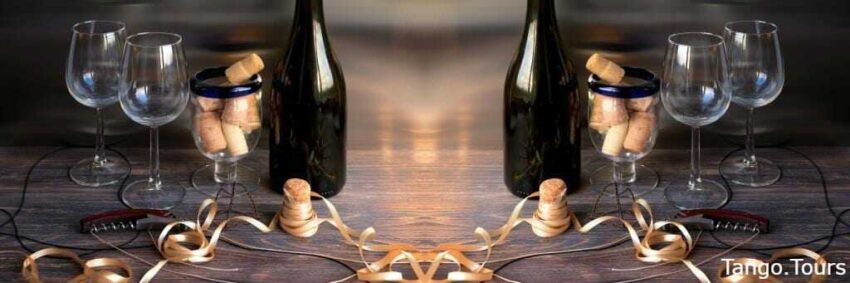 Two bottles of wine are sitting on a table.